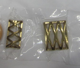 Alloy muffler chain resin button