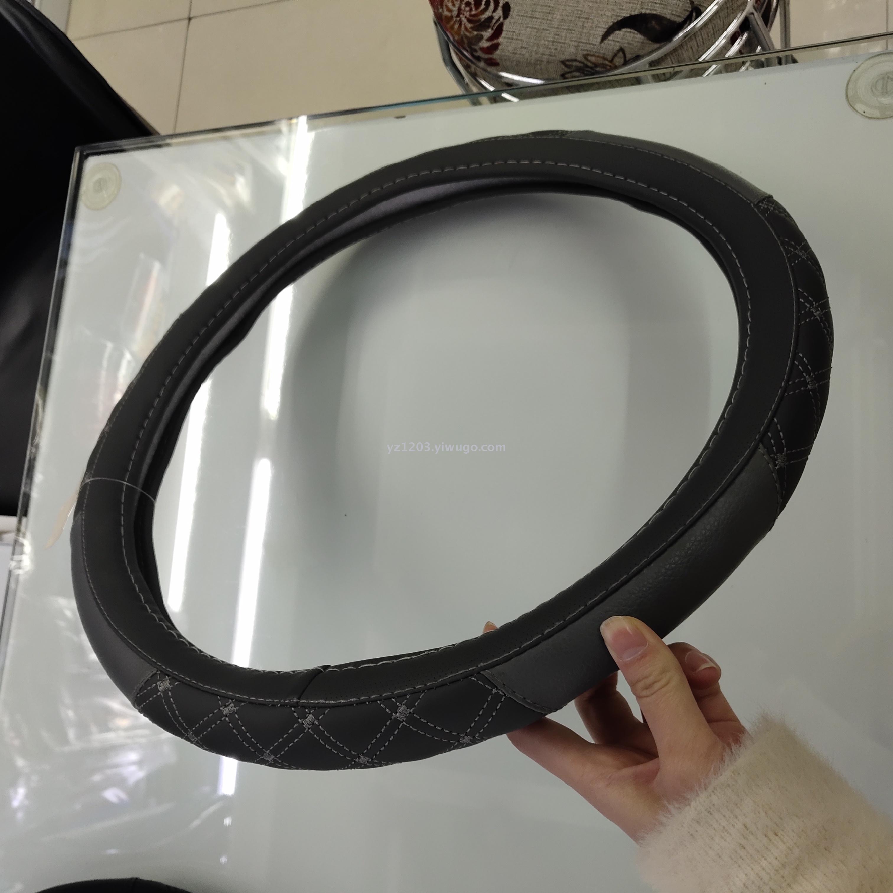 Anti - leather steering wheel cover manufacturer direct sales four seasons with hand sewing leather car handle cover