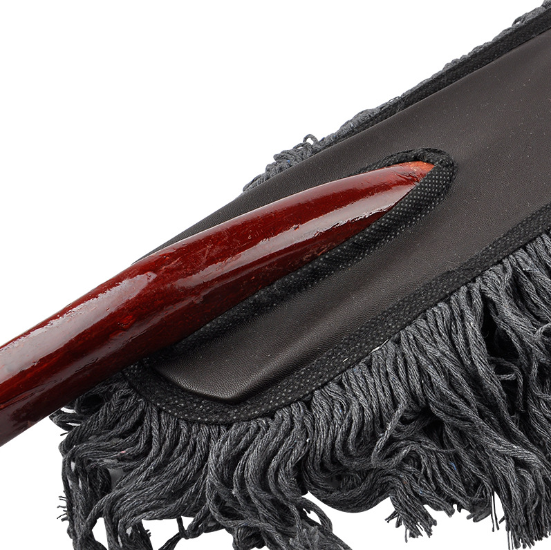 Car wash tool with red wood handle and wax brush