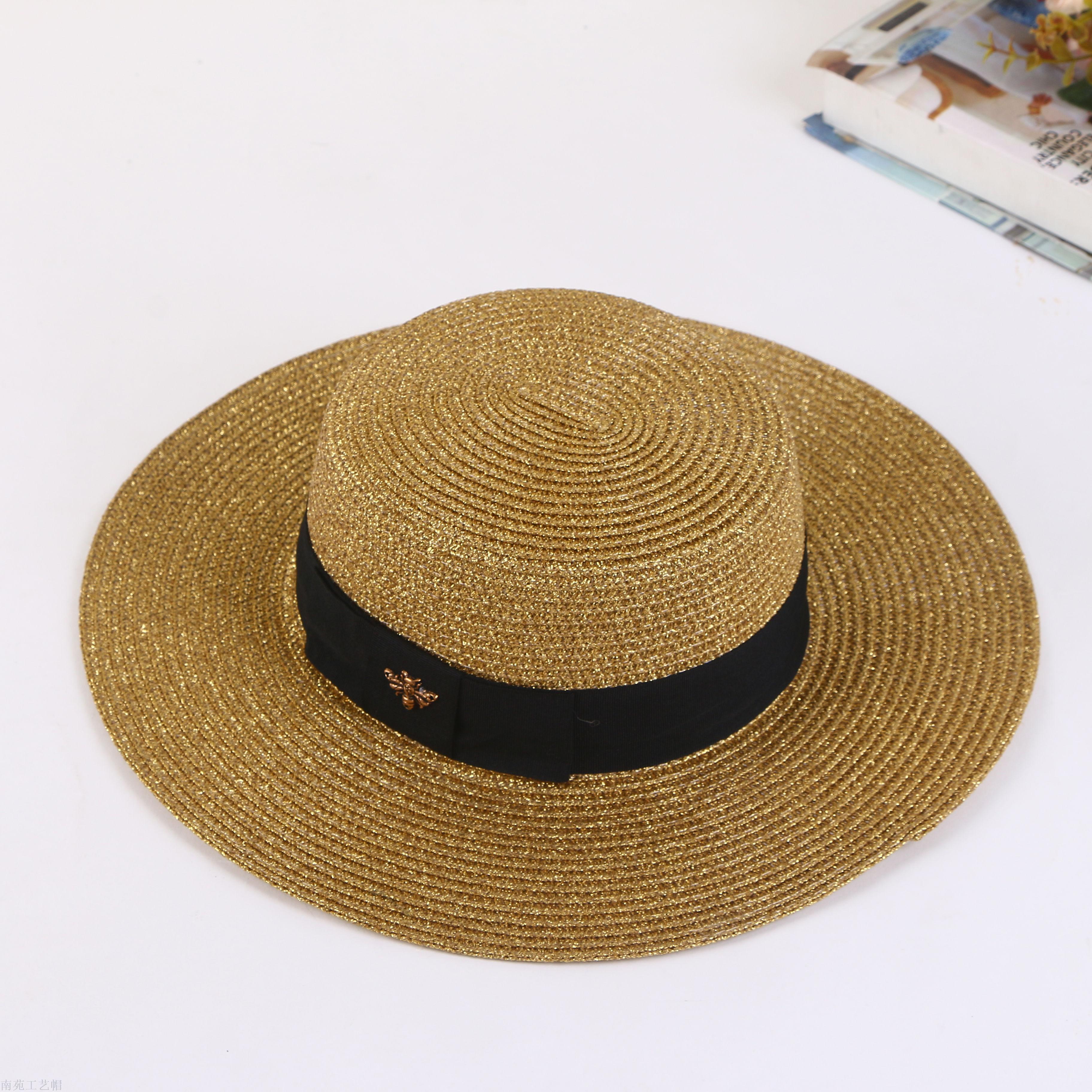 A straw hat with a large brim, and a hat for a summer hat.