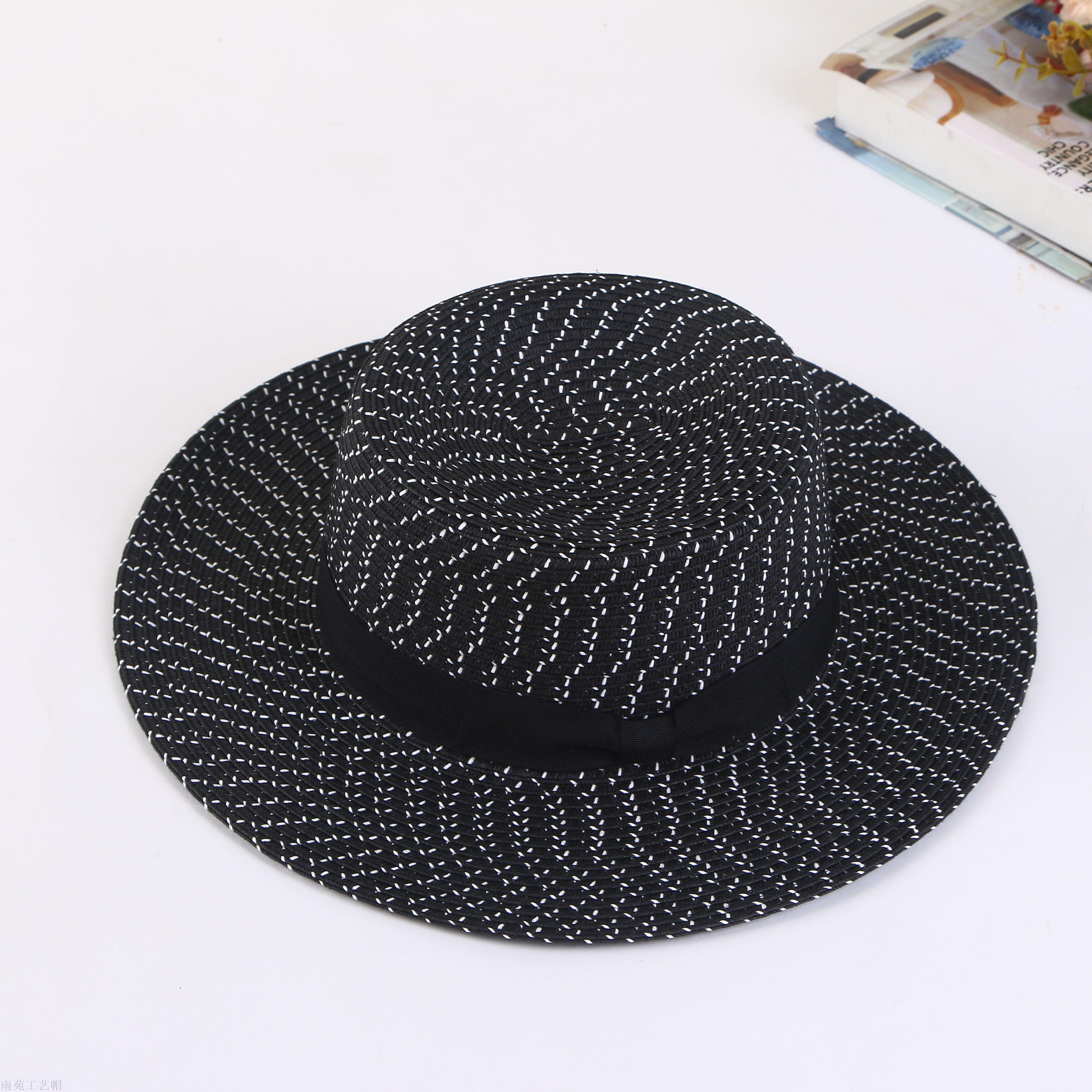 A straw hat with a large brim, and a hat for a summer hat.