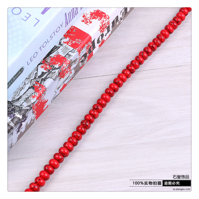The red turquoise spacer plate is separated by a disc of red and red stone accessories The red turquoise spacer plate is separated by a disc of red and red stone accessories