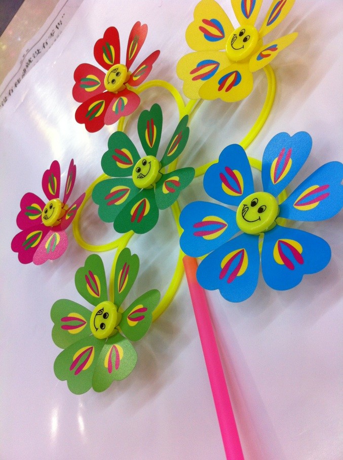 The new India six toy windmill windmill mixed new smiling face