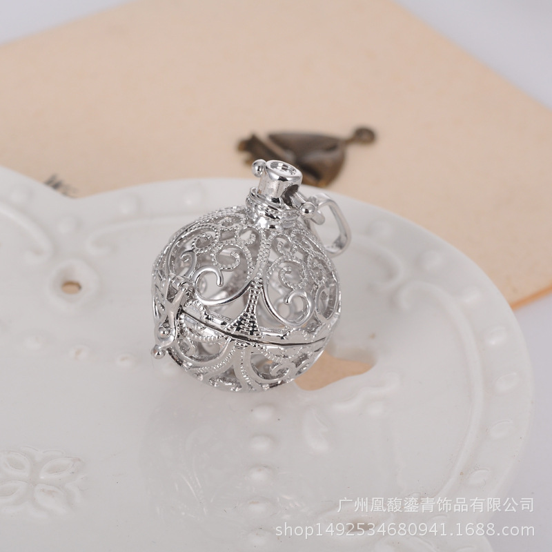 Factory direct sale lady jingyin ball refined oil bottle hollow - out five pointed star magic box aroma phase box sweater necklace pendant