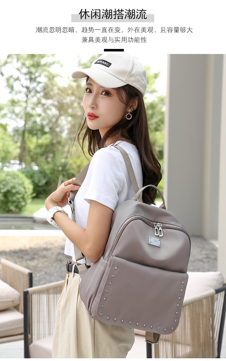 Foreign Trade Wholesale Spring and Autumn New Trendy Japanese and Korean Style Casual Temperament Sports Rivet XINGX Nylon Backpack Women's Bag Foreign Trade Wholesale Spring and Autumn New Trendy Japanese and Korean Style Casual Temperament Sports Rivet XINGX Nylon Backpack Women's Bag