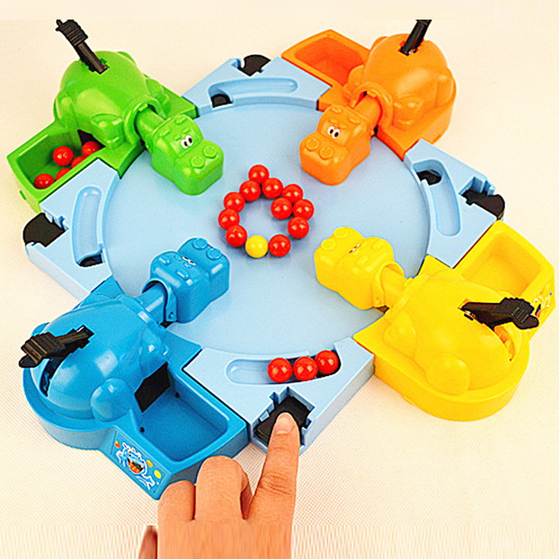 Hungry hippos feed frogs an updated version of the two-player competitive game Pinball for four interactive puzzle toys