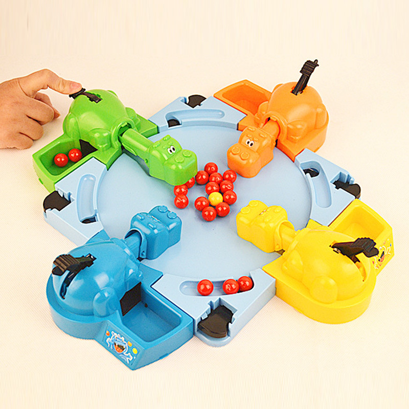 Hungry hippos feed frogs an updated version of the two-player competitive game Pinball for four interactive puzzle toys
