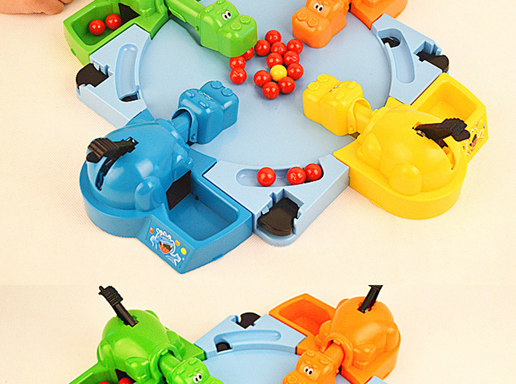 Hungry hippos feed frogs an updated version of the two-player competitive game Pinball for four interactive puzzle toys