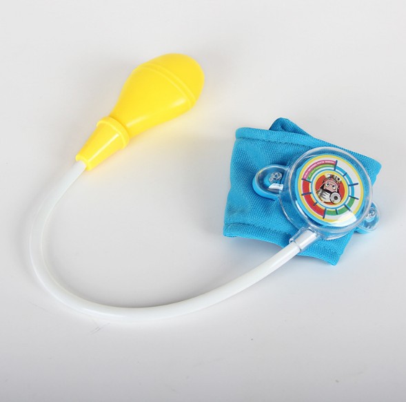 A child's imitation family doctor's toy takes blood pressure of a little doctor and nurse A child's imitation family doctor's toy takes blood pressure of a little doctor and nurse