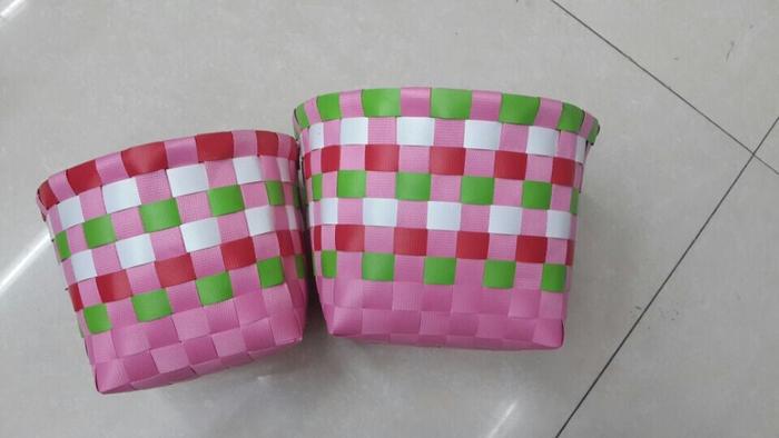 Set of 2 hand-woven Ribbon strapping round oval coloured storage baskets Set of 2 hand-woven Ribbon strapping round oval coloured storage baskets