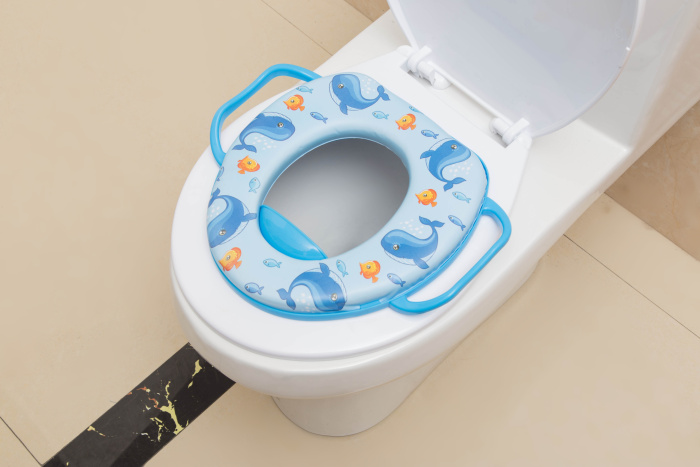 Children's seat with handle children with PVC printed soft cushion seat on the toilet seat. Children's seat with handle children with PVC printed soft cushion seat on the toilet seat.