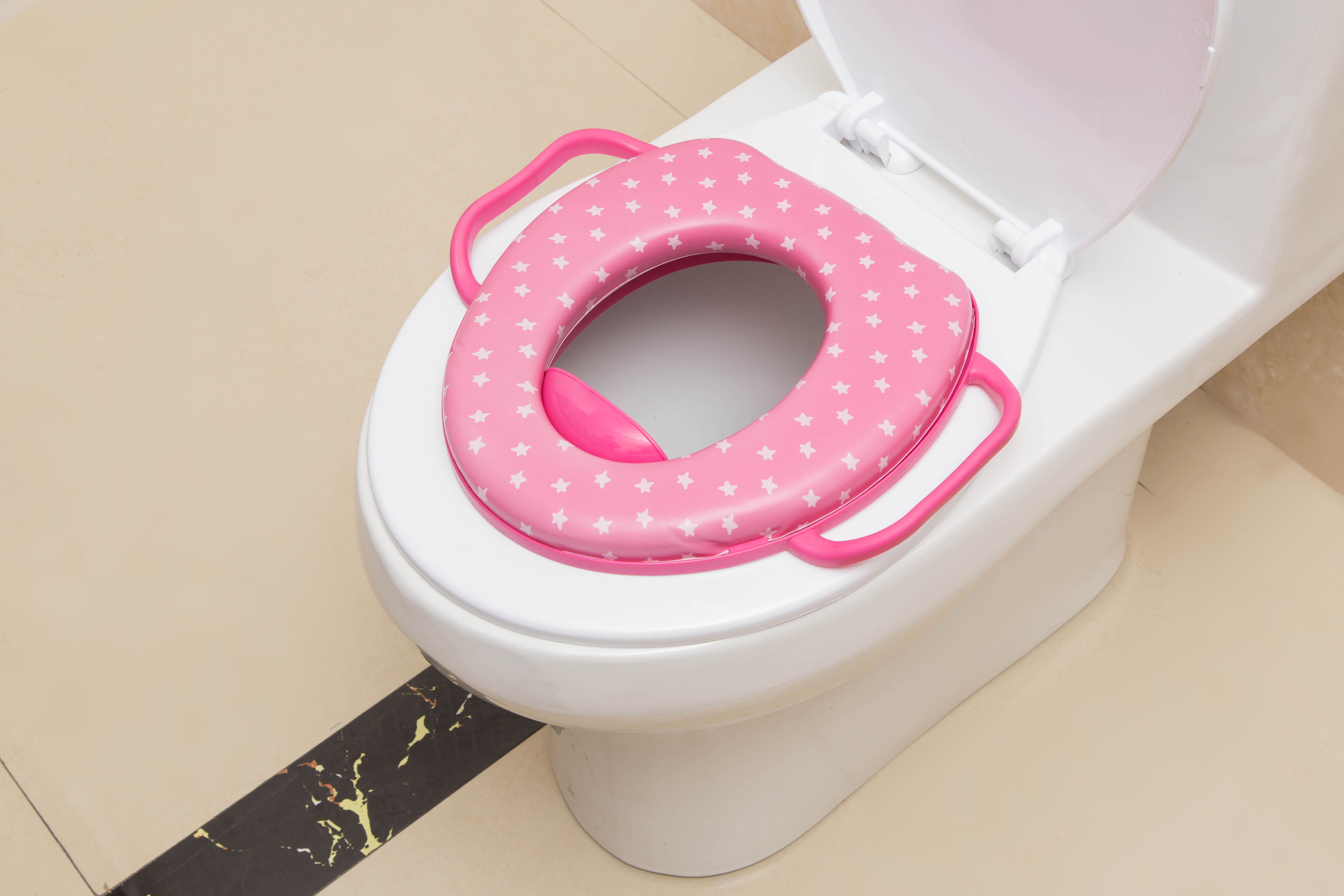 Children&#039;s seat with handle children with PVC printed soft cushion seat on the toilet seat.