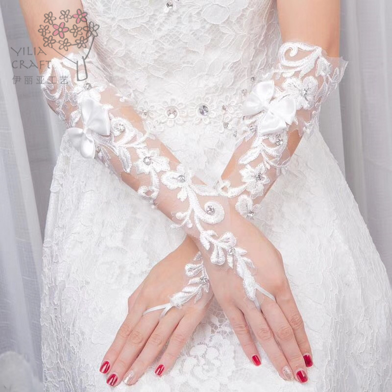 Korean lace bride&#039;s wedding dress wedding sun protection gloves contracted spring and winter gloves hollow long money.