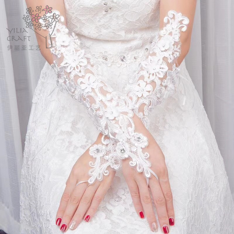 Korean lace bride&#039;s wedding dress wedding sun protection gloves contracted spring and winter gloves hollow long money.
