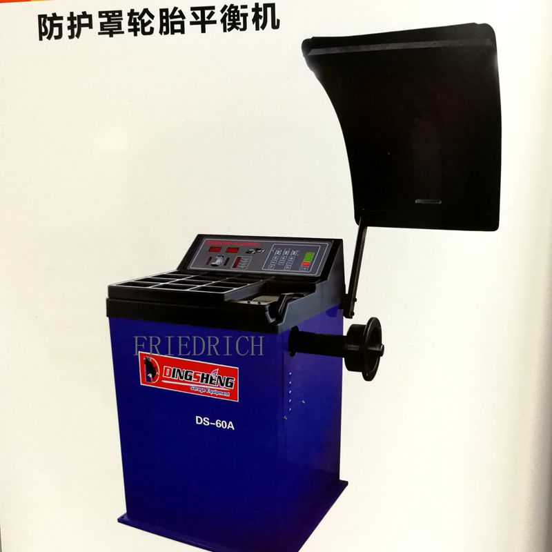 Small car with protective cover wheel tire balancing machine.