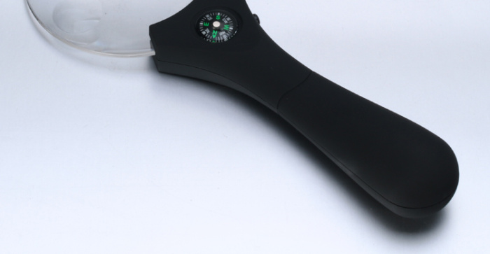 Hand-held magnifier with light diffuser with compass elderly elderly and children reading magnifier