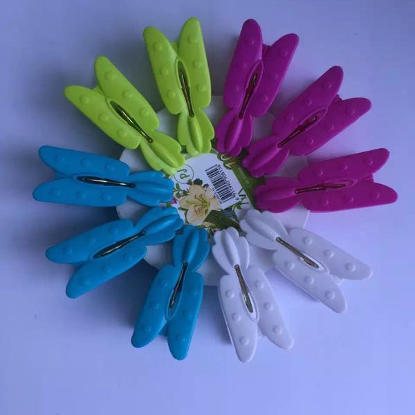 The butterfly shaped plastic clip is used for washing clothes. The butterfly shaped plastic clip is used for washing clothes.
